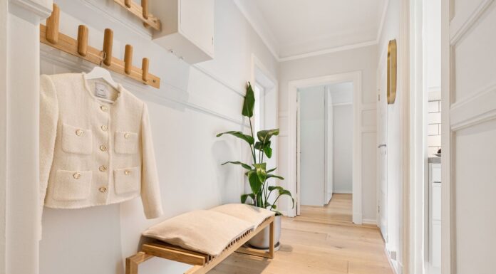 Organized shoe storage in a clear home hallway