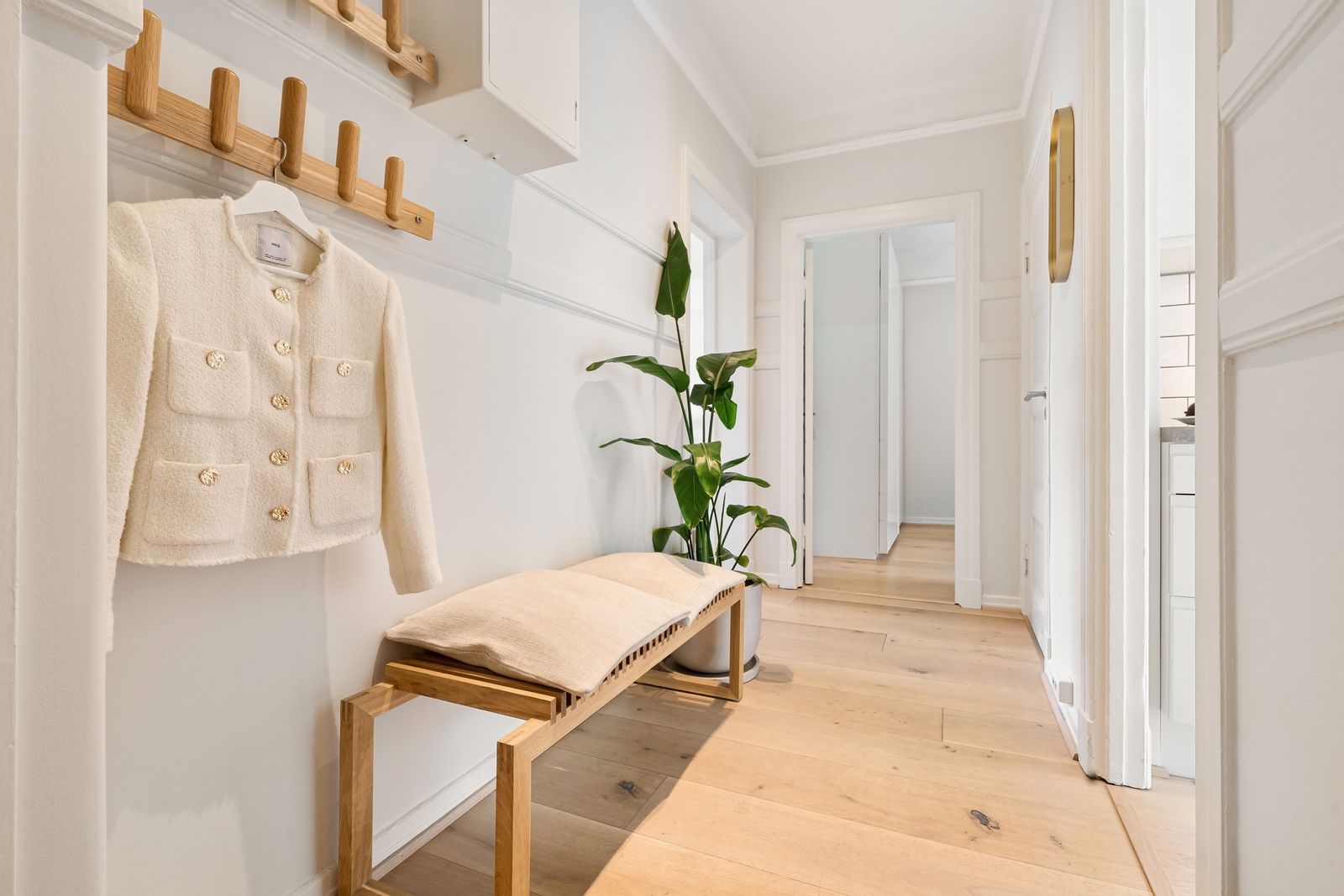 Organized shoe storage in a clear home hallway