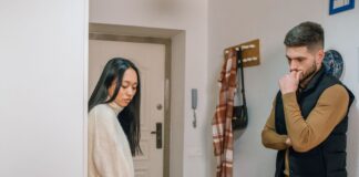 Couple addressing leaves laundry in the washer