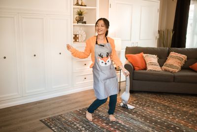 Partner vacuuming a shared living room as part of an agreed cleaning routine
