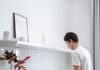 Partner washing dishes at a kitchen sink during household cleanup