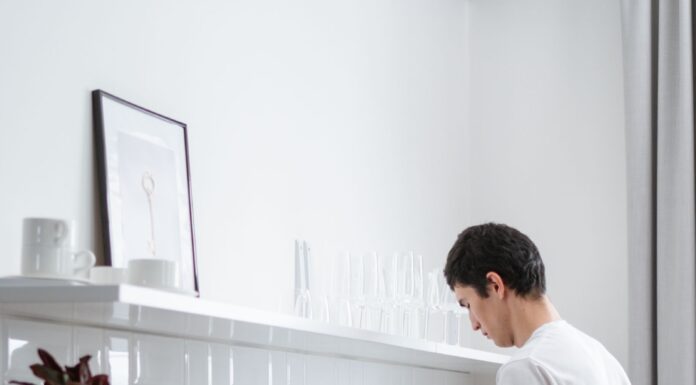 When Your Partner Never Replaces the Dish Sponge: How to Share Kitchen Cleaning Supplies Without Nagging Partner washing dishes at a kitchen sink during household cleanup