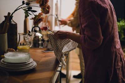 Partners calmly reviewing shared kitchen supplies together