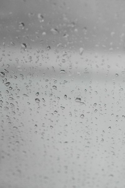 Raindrops on a home window during wet weather