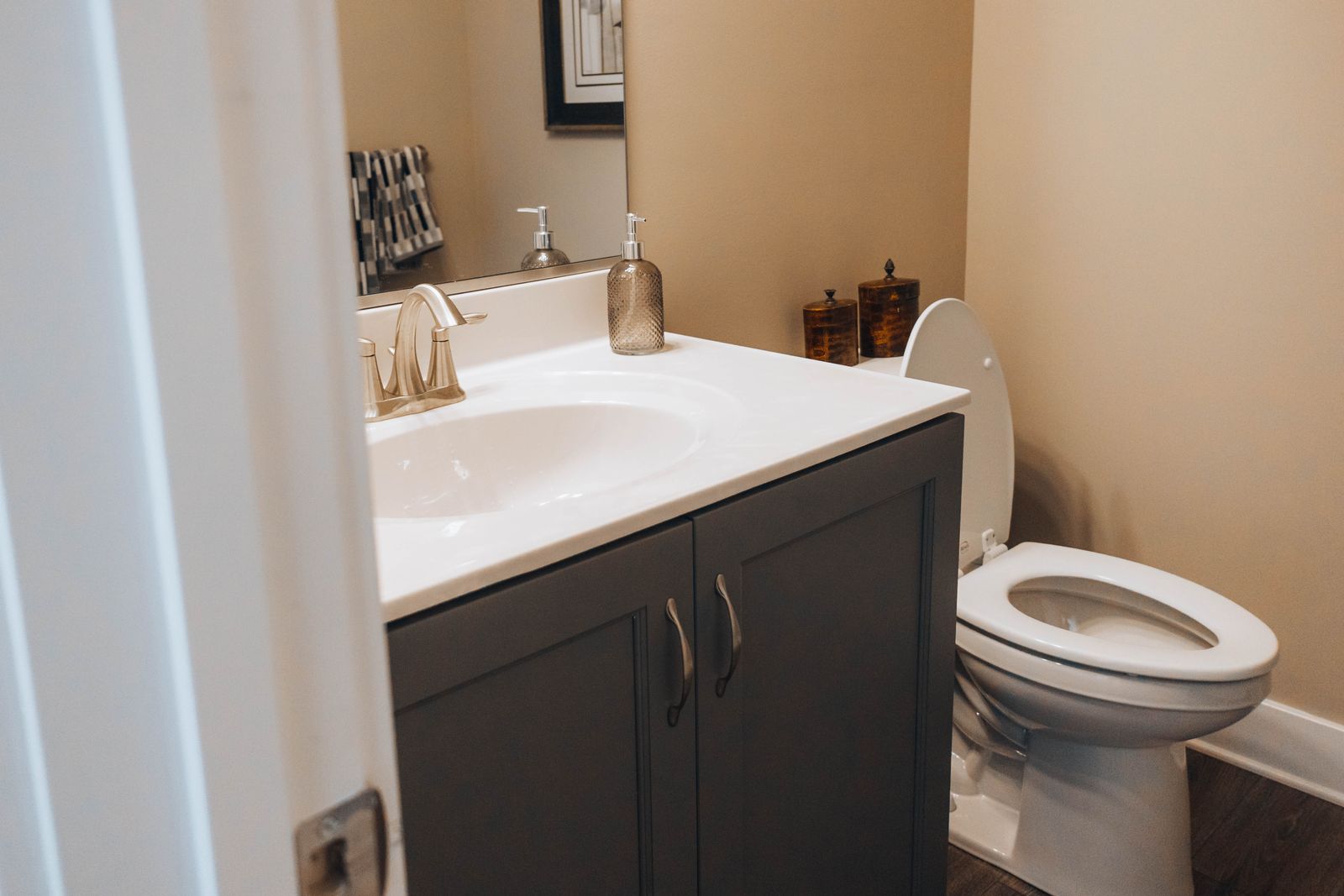 Clean shared bathroom with a toilet and sink