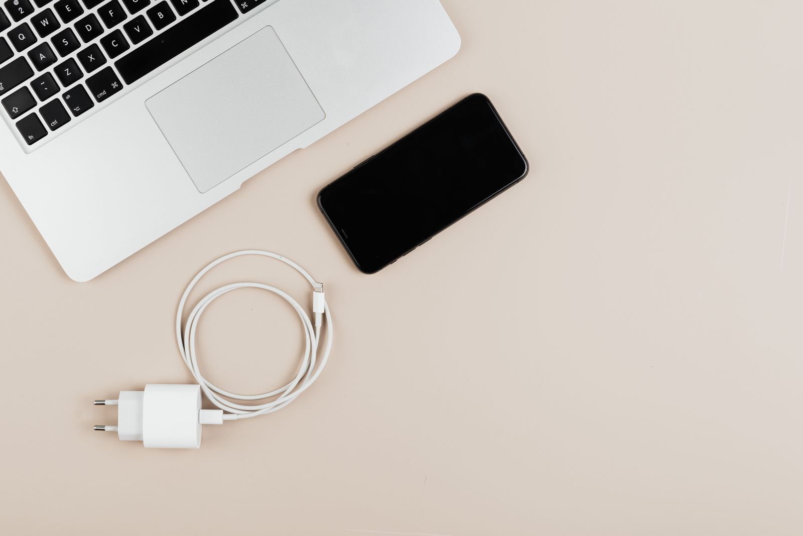 Phone and device chargers organized together on a table