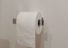 Toilet paper roll on a holder in a bathroom
