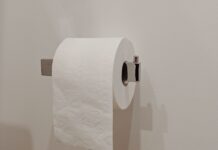 When Your Partner Never Replaces the Toilet Paper Roll: How to Fix the Bathroom Routine Without Nagging Toilet paper roll on a holder in a bathroom