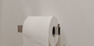 Toilet paper roll on a holder in a bathroom