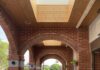 Ramp with handrails beneath a red brick archway in Taiwan