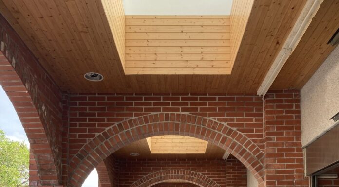 Accessible Couples Counseling: What to Ask Before Booking Ramp with handrails beneath a red brick archway in Taiwan