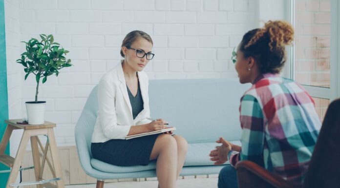 Changing Couples Therapists: How to Discuss Fit and Plan a Handoff Two adults speaking during a consultation in a modern counseling office