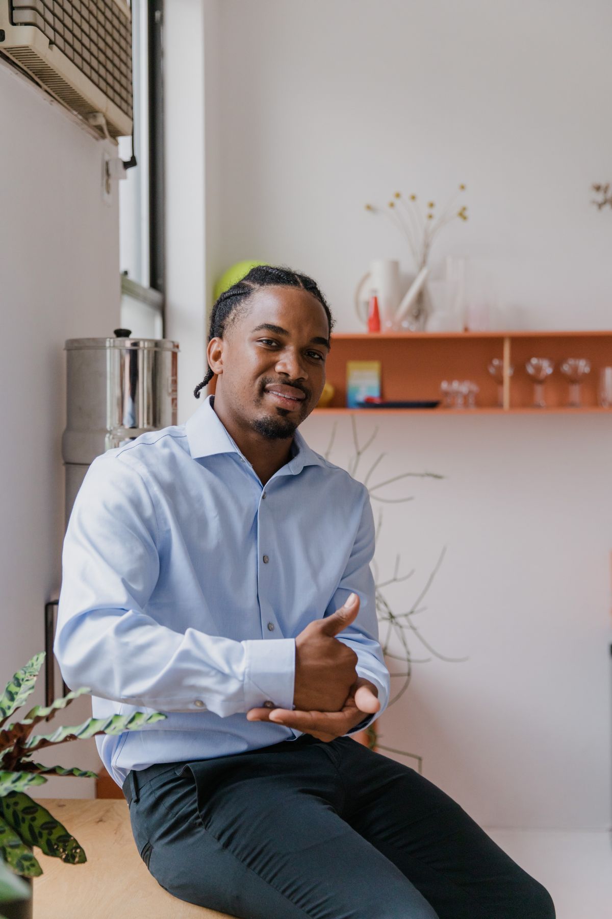 Man using sign language in a bright office