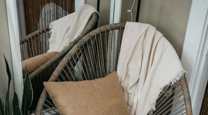 Couples Therapy With Chronic Pain: Planning More Comfortable Sessions Rattan chair with a cushion and throw beside books and a plant
