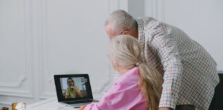 Older couple using a laptop for a video call at home