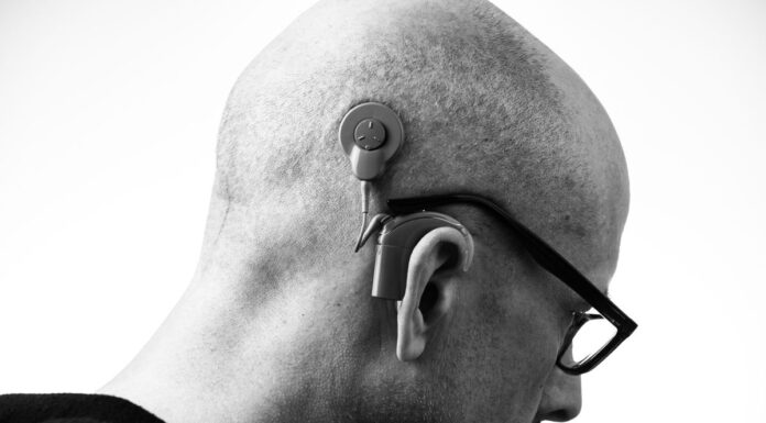 Couples Therapy When You Are Hard of Hearing: Asking for Communication Access Black and white profile of a man wearing glasses and a hearing aid