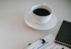 Couples Therapy Intake Forms: How to Prepare Without Writing a Perfect Story Clipboard with a questionnaire, pen, and coffee on a therapist office table