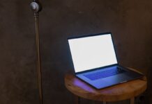 Laptop with a blank screen on a wooden table