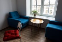 Modern living room with blue armchairs and wooden furniture
