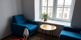 Modern living room with blue armchairs and wooden furniture