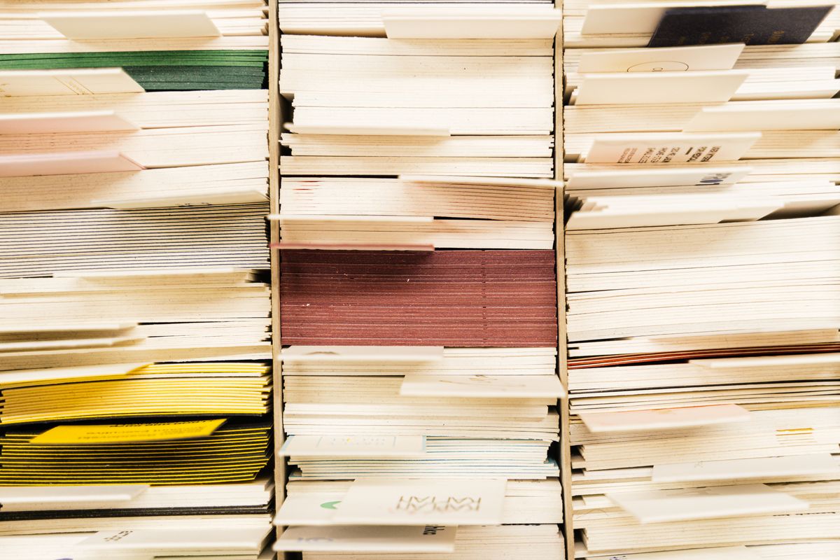 Close-up of paper documents organized in a filing system