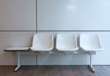 Couples Therapy Waitlists: How to Find Support While You Wait White chairs in an empty indoor waiting area