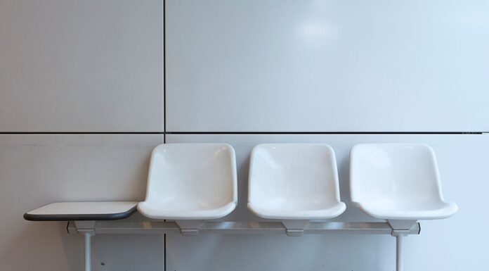 Couples Therapy Waitlists: How to Find Support While You Wait White chairs in an empty indoor waiting area