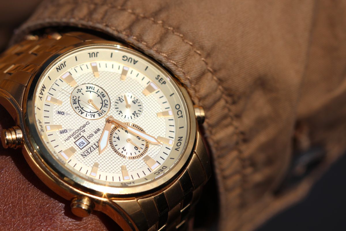 Close-up of a metal chronograph wristwatch on a person's wrist