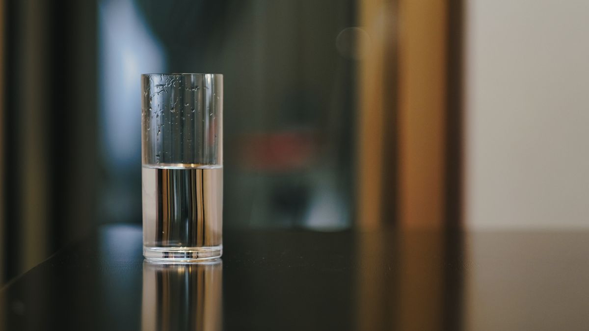 Close-up of a clear glass of water on a wooden table